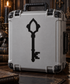 Gothic black key vinyl decal with pointed arch head and ornate bow, centered on a case