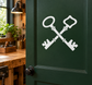 Twin vintage keys vinyl decal with white crossed keys on green door panel