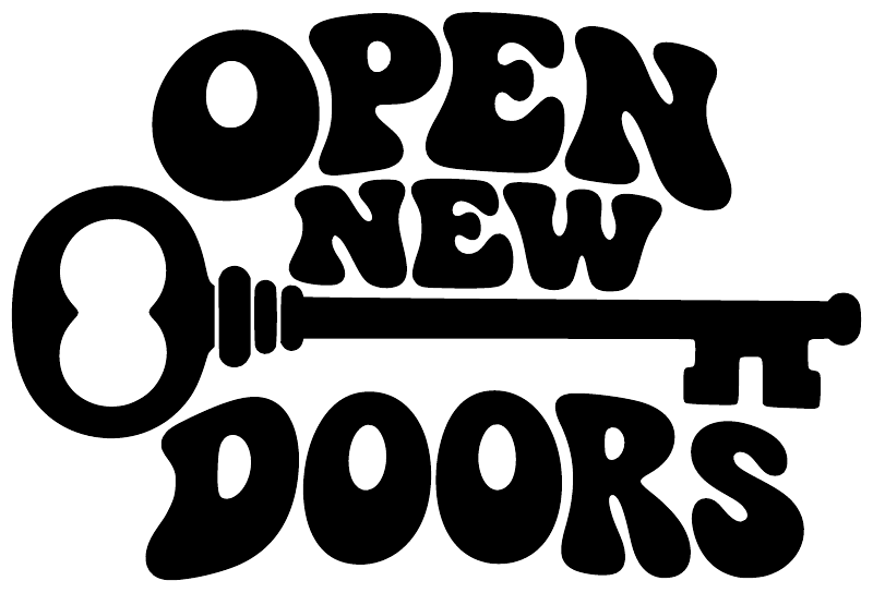 Black vinyl decal with cutout text "OPEN NEW DOORS"