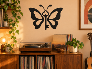 Black vinyl key and butterfly decal on wall