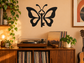 Black vinyl key and butterfly decal on wall