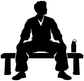 Black vinyl decal of seated martial artist with “T” letters and bottle accessory
