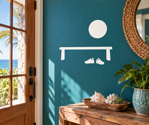 White vinyl decal: round emblem, bench shape, and two shoe silhouettes on wall