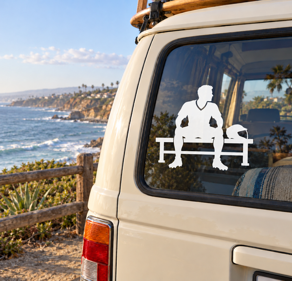 Lacrosse bench vinyl decal on car window: white player silhouette sitting on bench