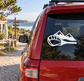 Red car rear window with white mountain and lacrosse stick vinyl decal
