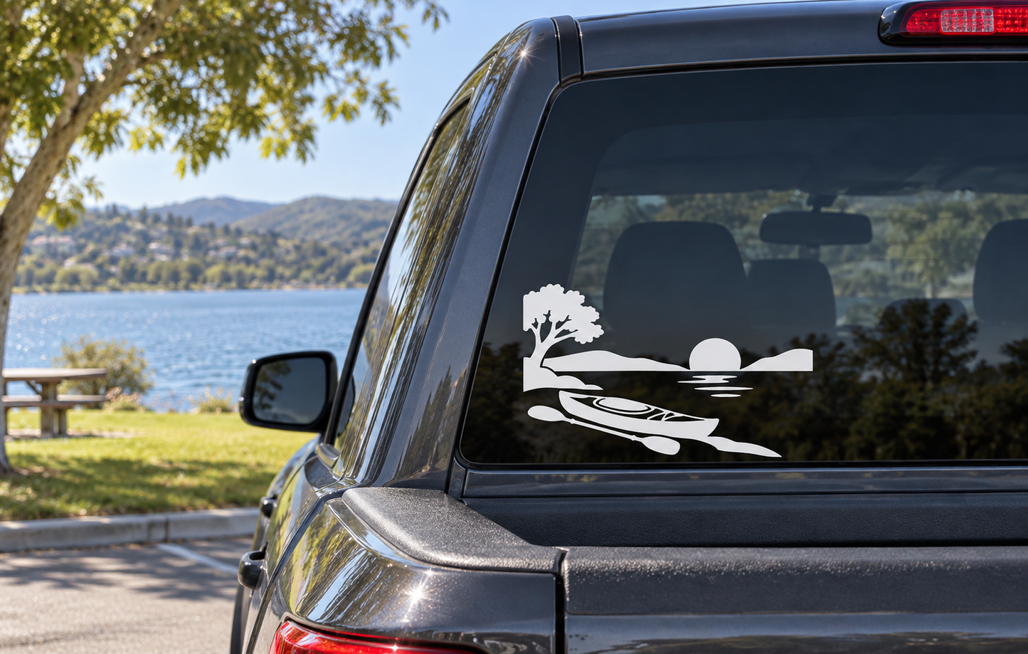 Lake Mission Viejo lake kayak vinyl decal on car rear window, white horizon silhouette.
