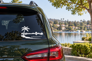 Vinyl car decal with palm tree over lake horizon and water reflection silhouette