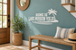 Vinyl wall decal reading 'HOME IS LAKE MISSION VIEJO' with palm tree and waves
