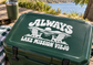 White vinyl decal reading ALWAYS and LAKE MISSION VIEJO on dark surface
