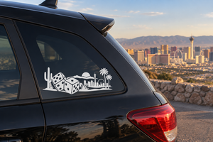 Lucky dice horizon vinyl decal on dark car door, city skyline and desert silhouettes