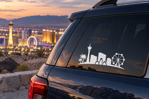 Vinyl car window decal showing white skyline icons, palm tree, and ferris wheel