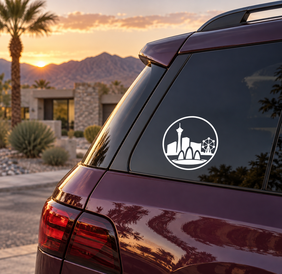 Round skyline vinyl decal on car rear window, white icon on dark surface