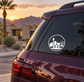 Round skyline vinyl decal on car rear window, white icon on dark surface