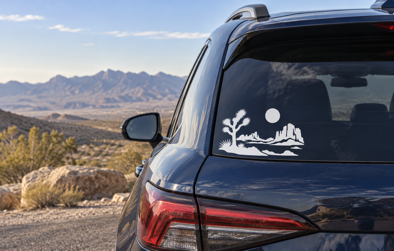 Desert horizon vinyl decal with Joshua tree, mountains, and sun on rear window