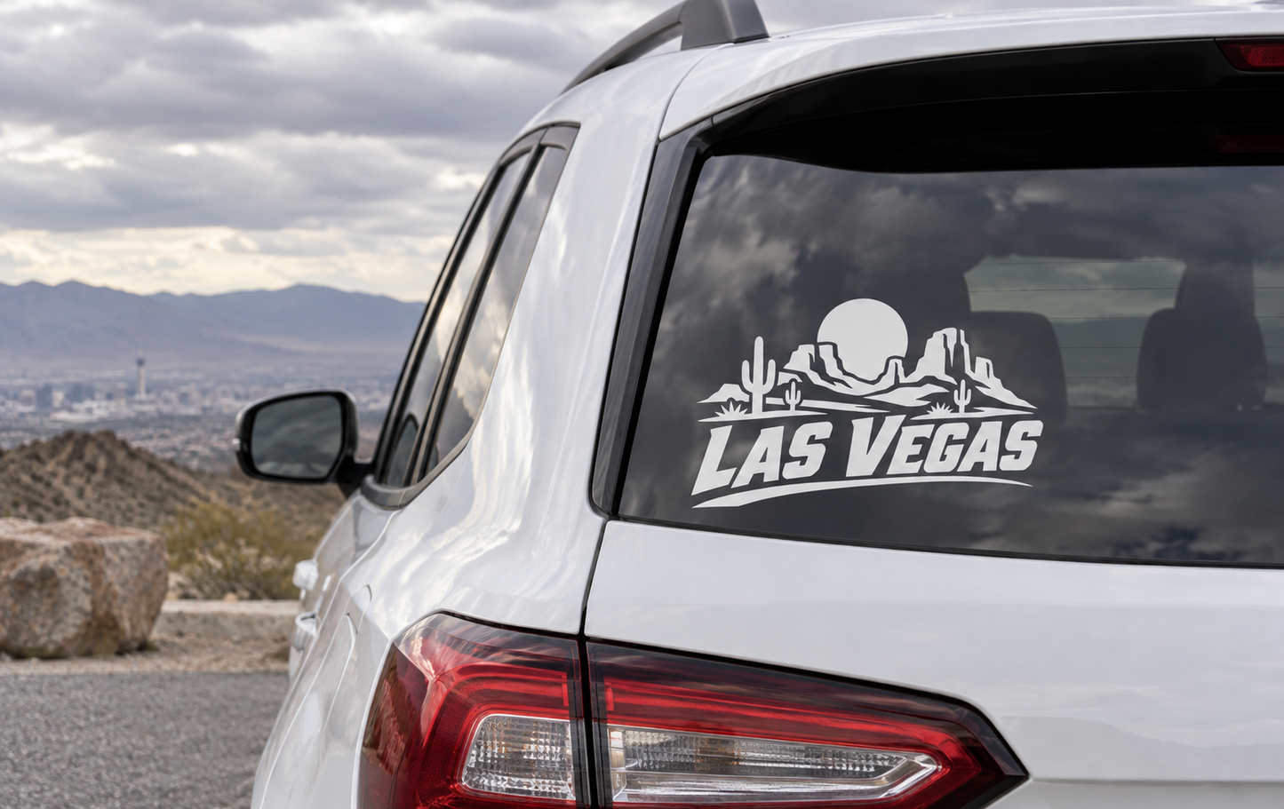 Las Vegas wordmark vinyl decal with skull, mountains, and cacti on car rear window