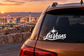 Las Vegas lettering vinyl decal on car rear window, white script with star