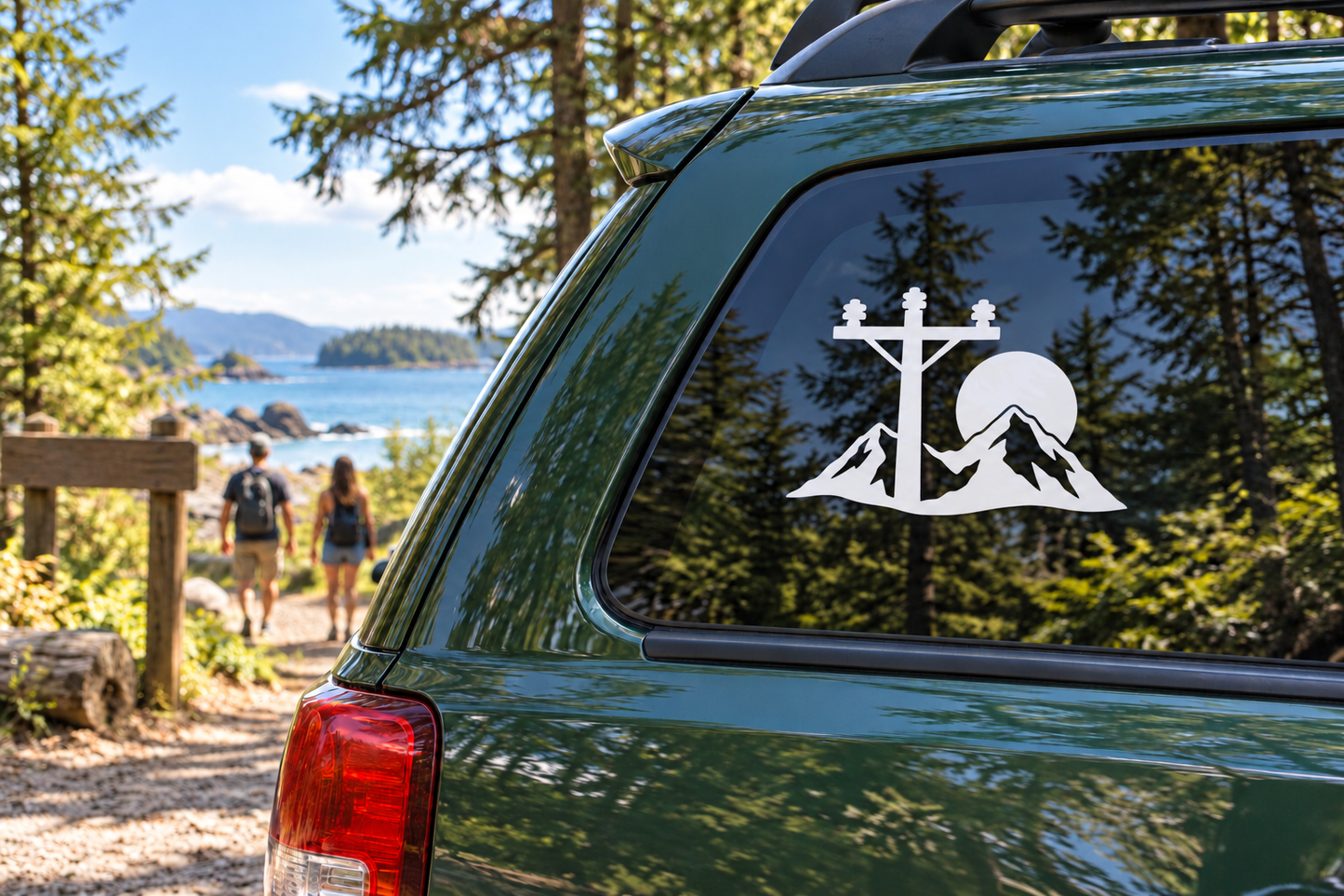 Vinyl decal of pole with mountains and anchor-style symbol on car rear window