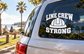Vinyl decal with LINE CREW STRONG text and helmet icon on dark window