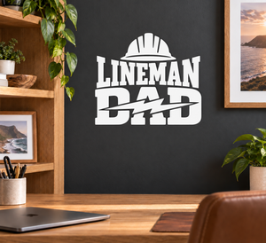 White lineman dad vinyl decal with helmet, tools, and bold LINEMAN text