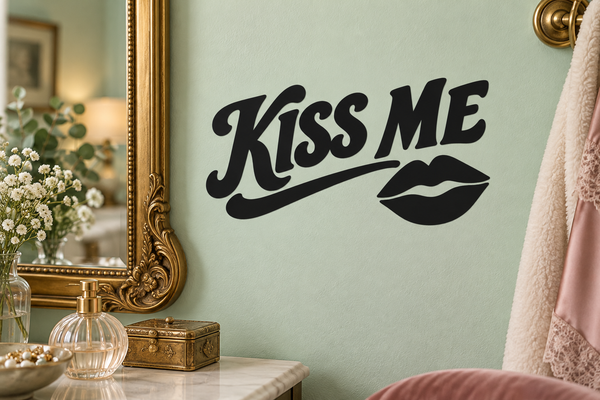 Black Kiss Me vinyl wall decal with script lettering and two-lip icon