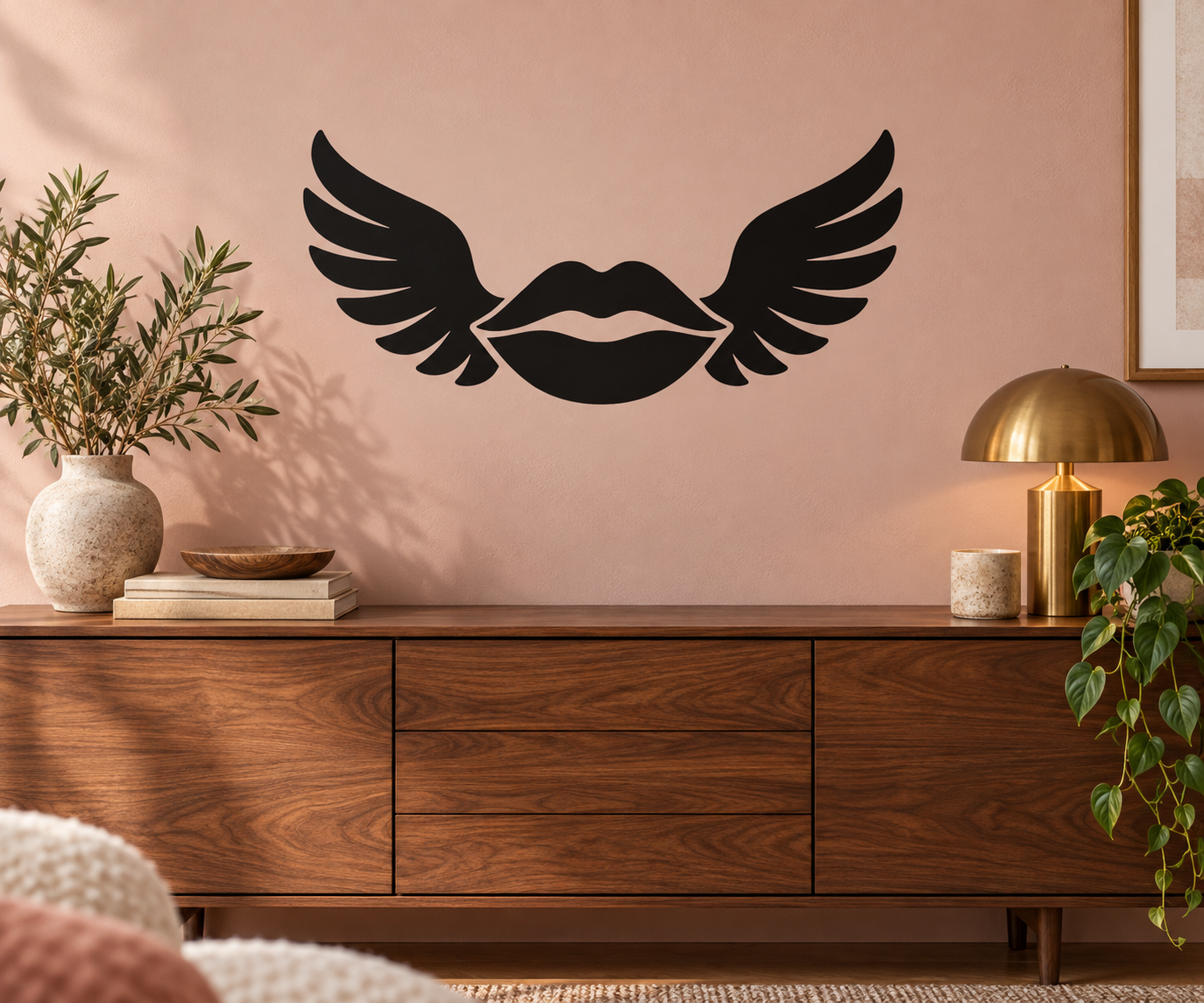 Vinyl wall decal of black lips with wing outlines, centered on a wall