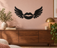 Vinyl wall decal of black lips with wing outlines, centered on a wall