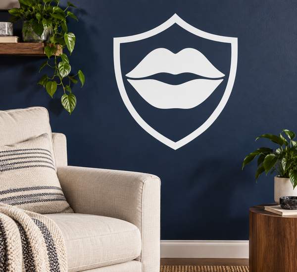 Vinyl decal of an open lips icon inside a shield outline, white color