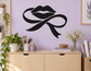 Black lips and flowing ribbon loop vinyl decal for walls, bold high-contrast silhouette