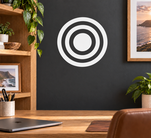 Vinyl bullseye decal with concentric black and white circles on a wall