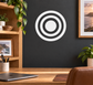Vinyl bullseye decal with concentric black and white circles on a wall