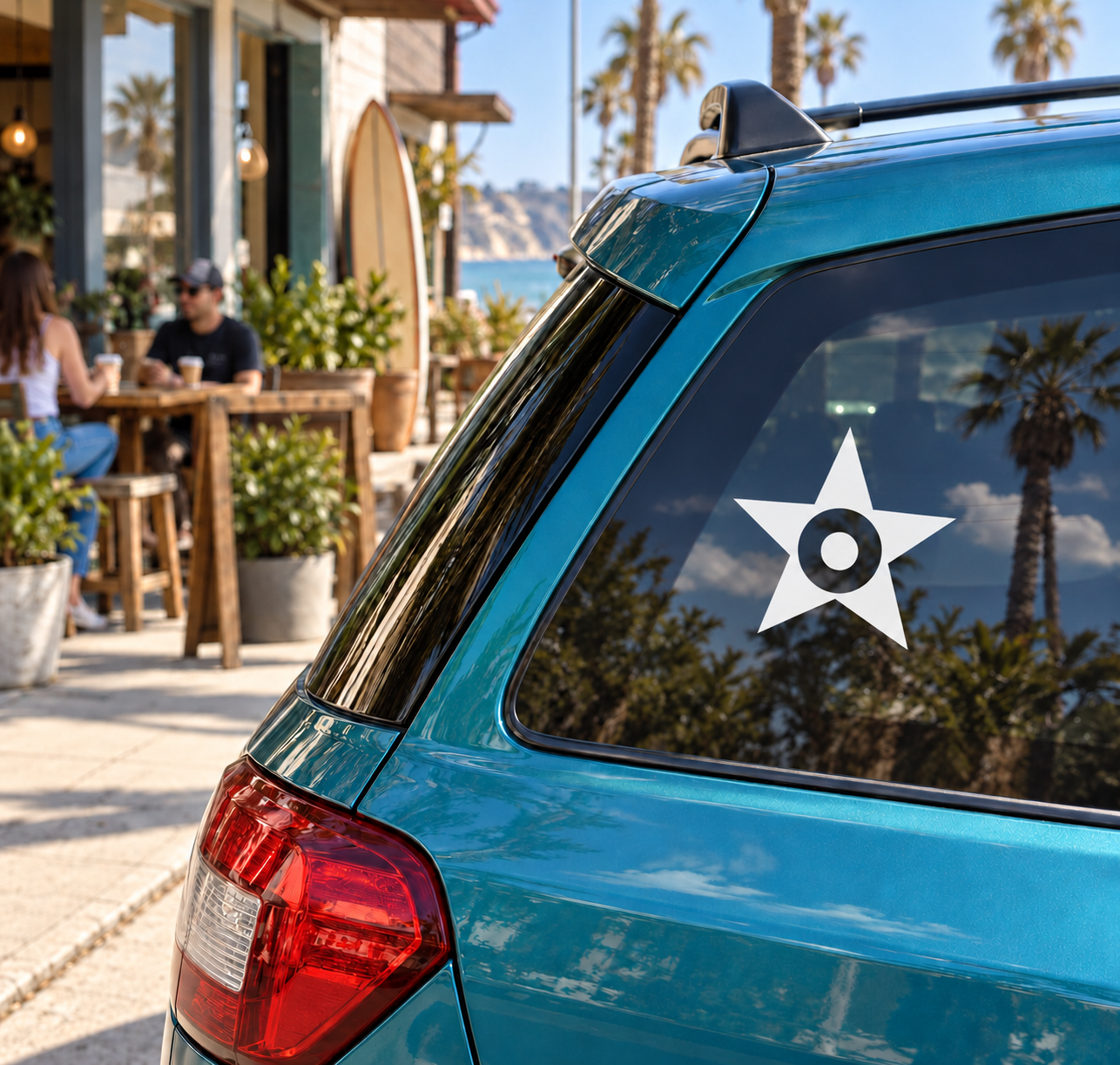 White star with target vinyl decal on car rear window.