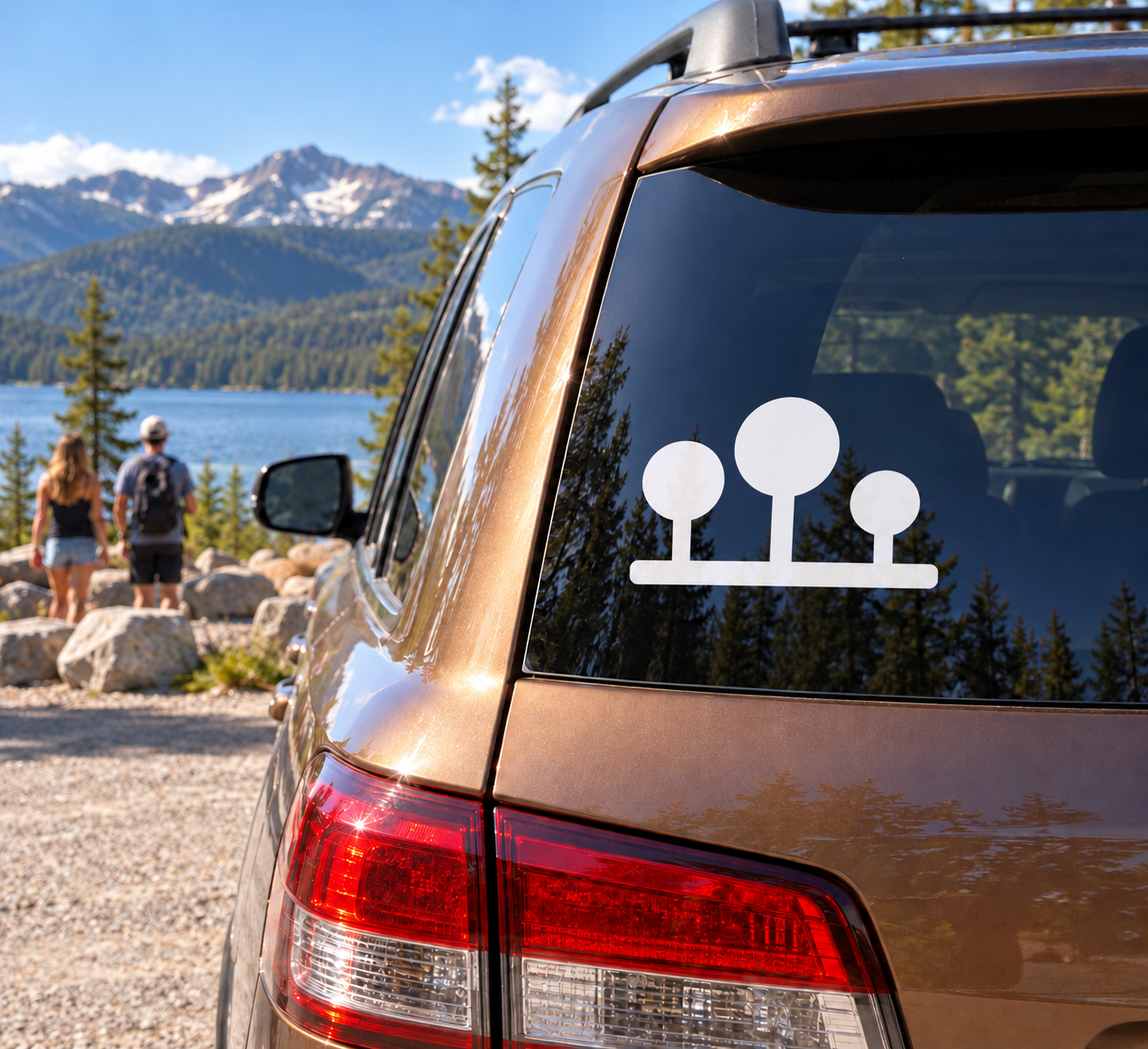 Three-plate emblem vinyl decal with white icon on car rear window