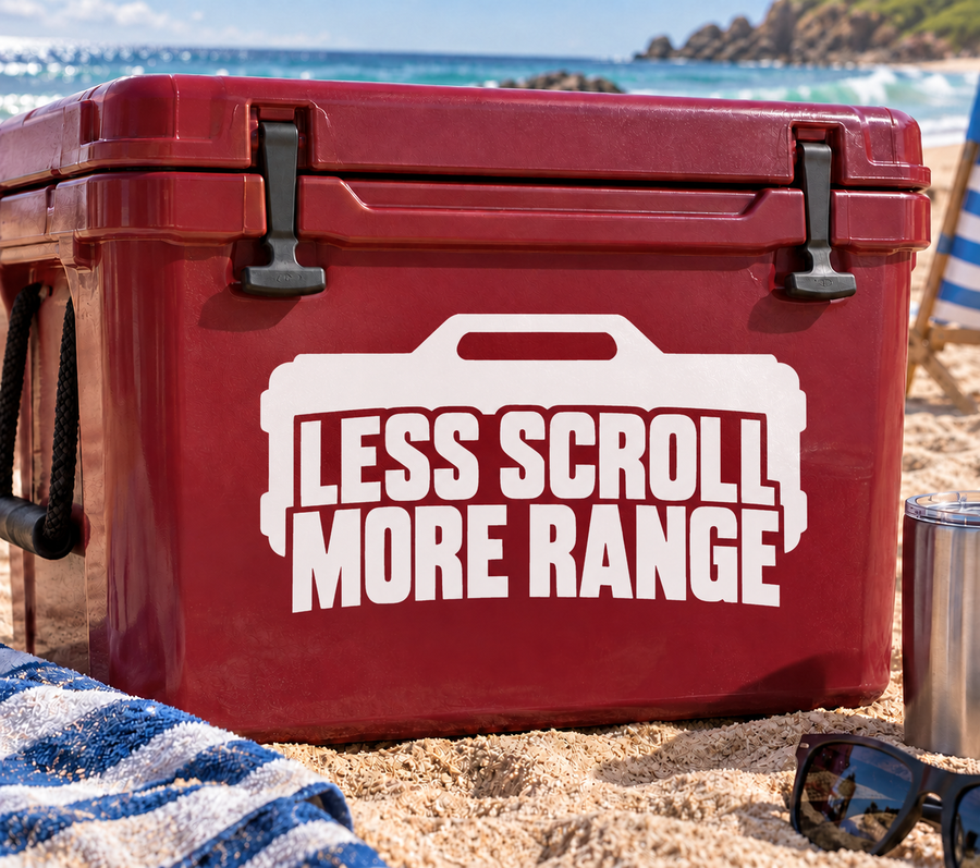 White vinyl decal reading "LESS SCROLL MORE RANGE" on a red cooler lid