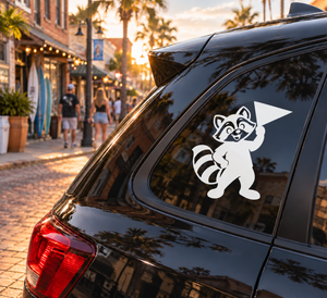 Black and white raccoon mascot vinyl decal on car window, rally-ready design