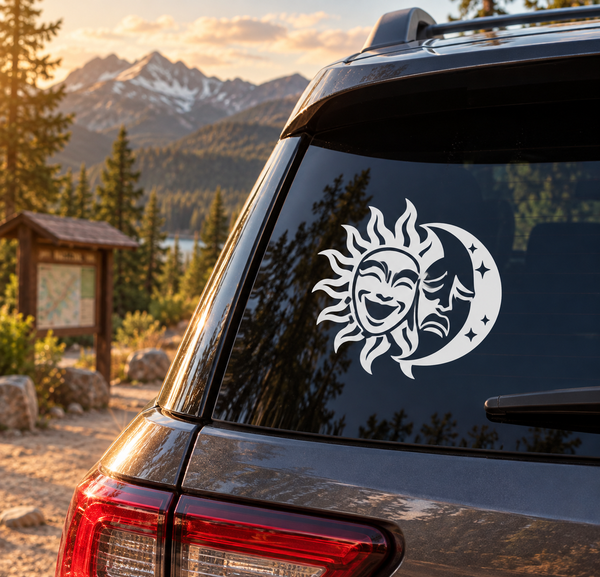 Sun and moon theater masks vinyl decal on dark car window