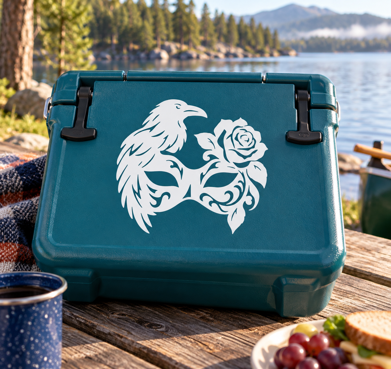 Teal surface with white raven half-mask vinyl decal and rose design