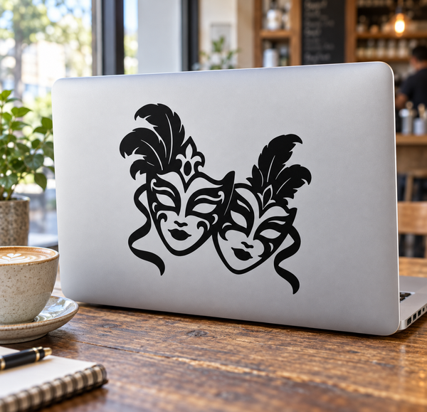 Two black carnival mask faces vinyl decal on laptop lid