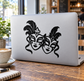 Two black carnival mask faces vinyl decal on laptop lid