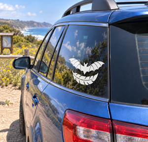 Bat flight vinyl decal with black-and-white bat silhouette on car window
