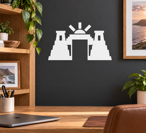 Stepped sunrise gateway vinyl decal in black and white silhouette on a wall