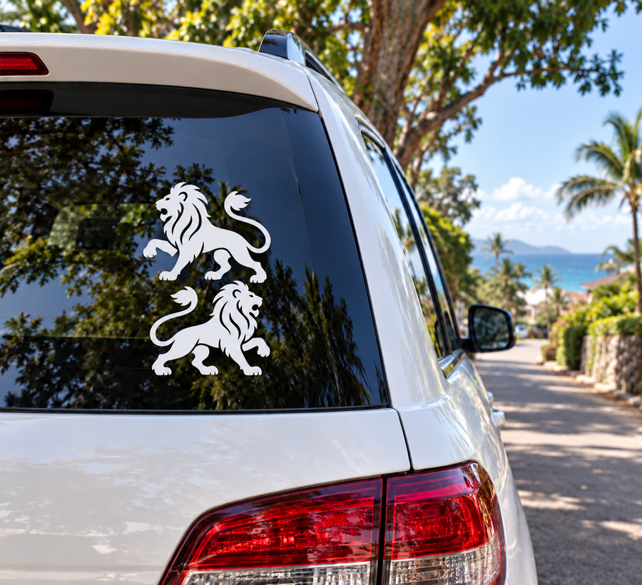 Pair of white medieval lion vinyl decals on car rear window