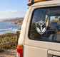 Shield-shaped vinyl decal with black key and leaf accents on vehicle window