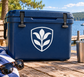 Shield-shaped vinyl decal with black lily emblem on a dark blue surface