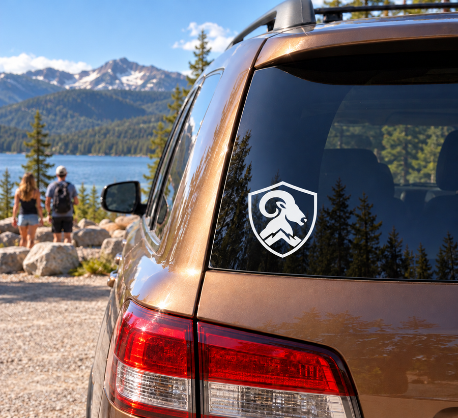 Shield vinyl decal with black ram head emblem on car window