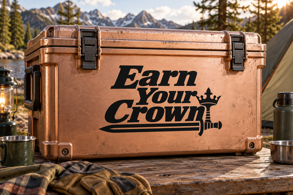 Vinyl decal on brown treasure chest: black “Earn Your Crown” text with sword icon