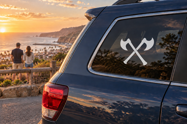 Crossed broad axes vinyl decal: white emblem with black axes for car windows