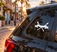 Twin spear pennant vinyl decal in white on car window glass