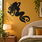 Black mermaid vinyl decal on wall above a bed