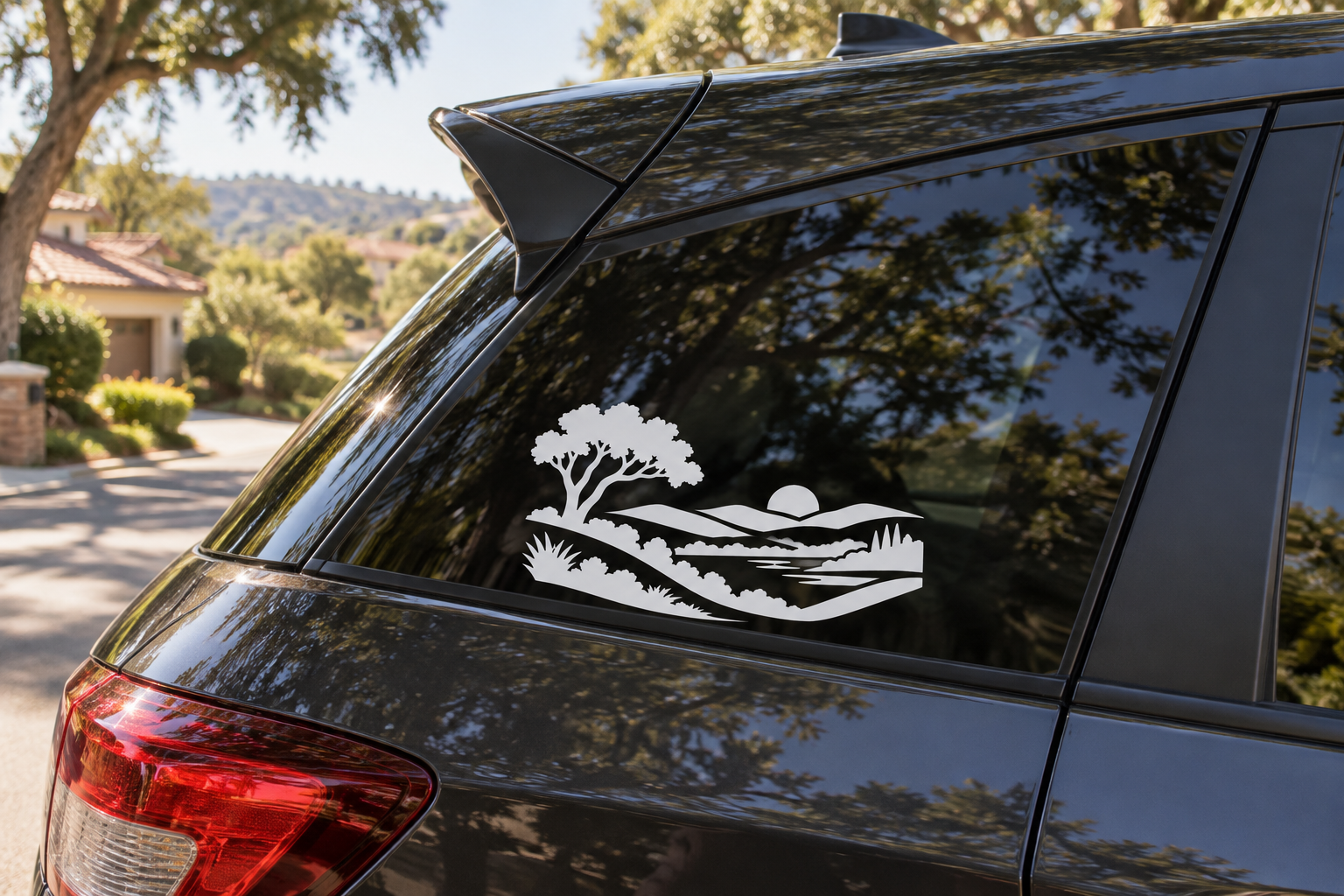 White vinyl landscape icon decal on car rear window