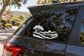 White vinyl landscape icon decal on car rear window